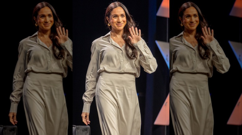 Meghan Markle on stage in a skirt suit