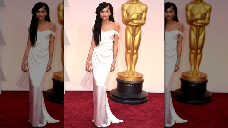 Zendaya wearing a white, column dress at the Oscars