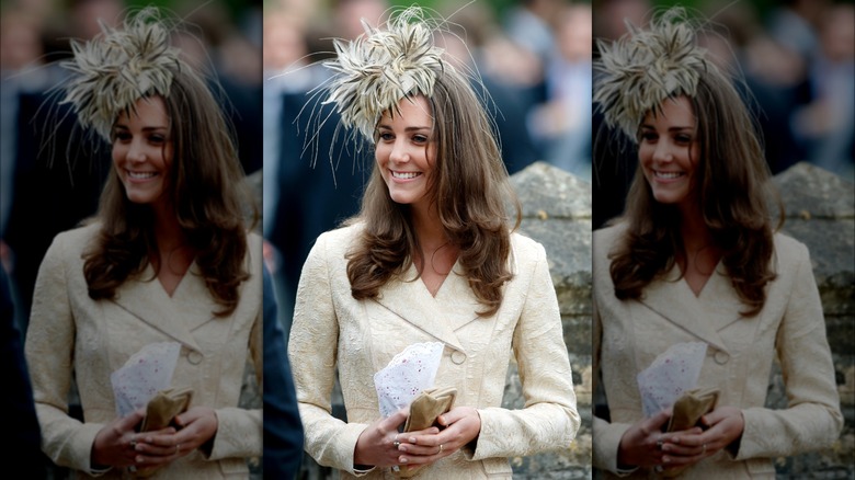 Kate Middleton in a cream coat and feathery hat