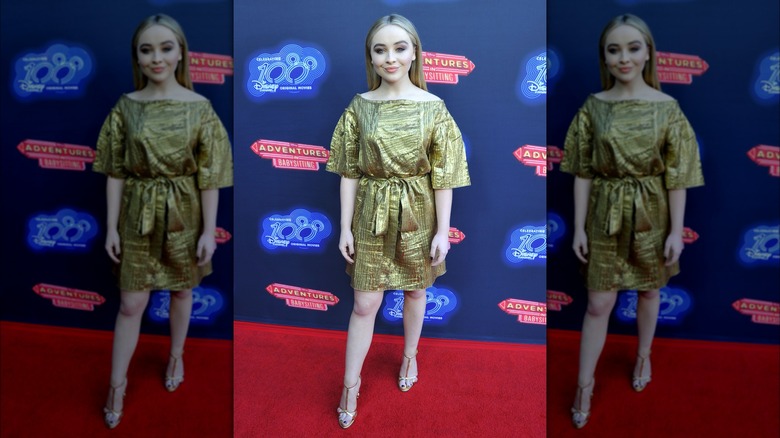 Sabrina Carpenter in a gold dress