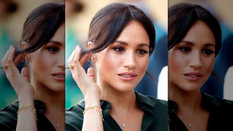 Meghan Markle with a signet ring on her ring finger