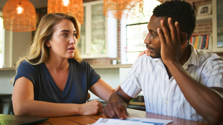 Woman and man talking seriously