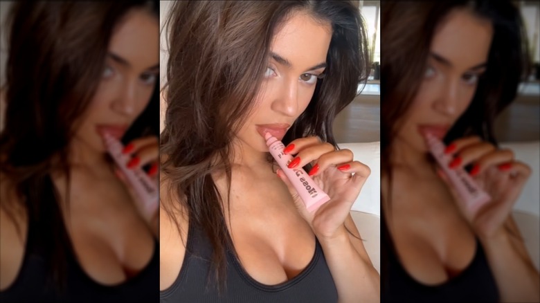 Kylie Jenner applying makeup