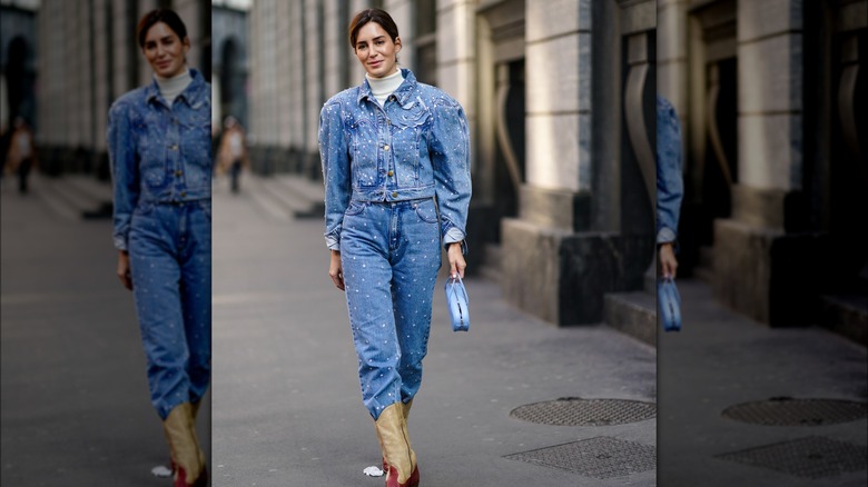 A woman wearing a denim outfit 