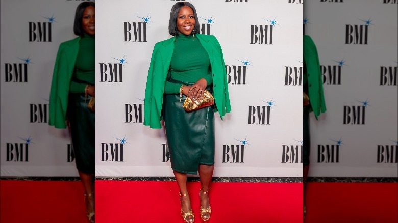 Woman in green leather pencil skirt 