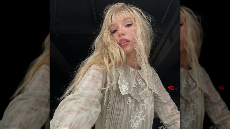 Lennon Stella wearing sheer embroidered shirt