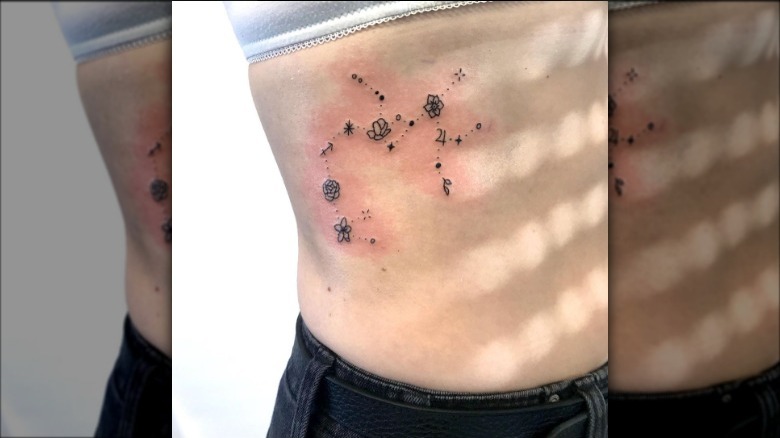 Flowers and constellation tattoo