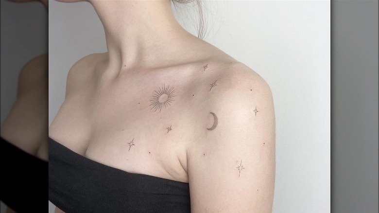 Stars, moon, and sun tattoo