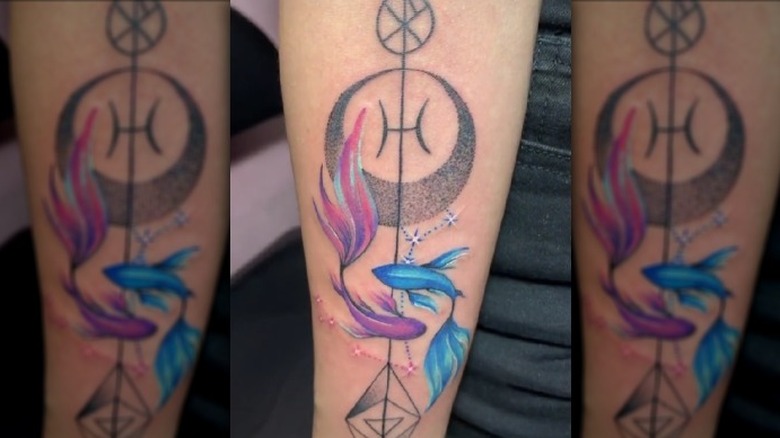 Pisces forearm tattoo
