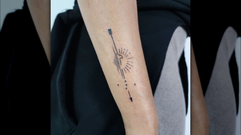 Arrow and sea tattoo