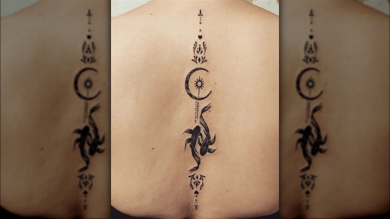 Pisces back tattoo