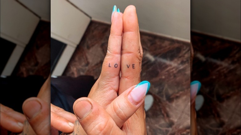 Love finger tattoo