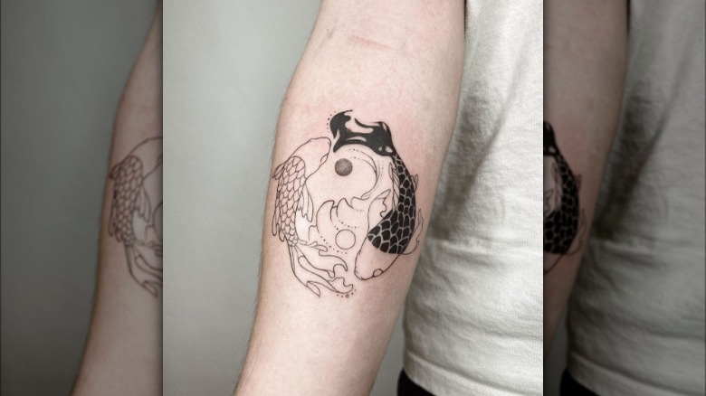 Pisces ying and yang tattoo