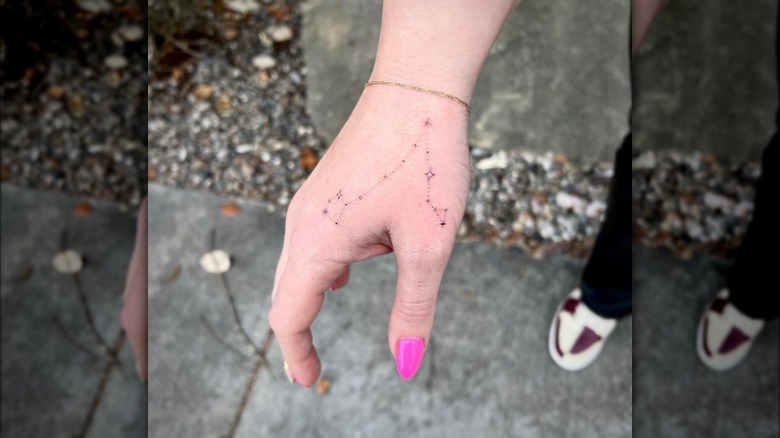 Pisces constellation hand tattoo