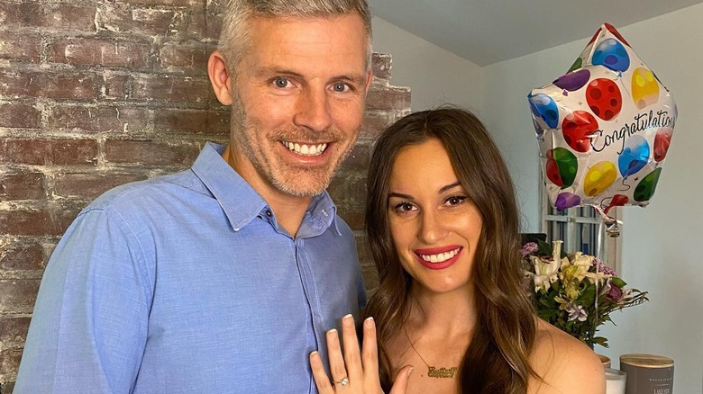 Hannah Berner and Des Bishop showing off engagement ring