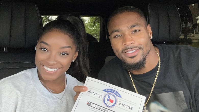 Simone Biles and Jonathan Owens with their marriage license