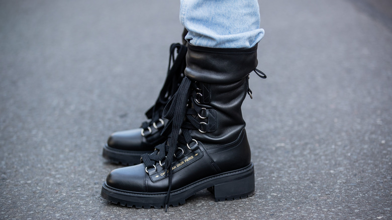 A woman wearing combat boots 