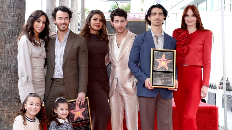 Danielle Jonas and Priyanka Chopra with the Jonas family