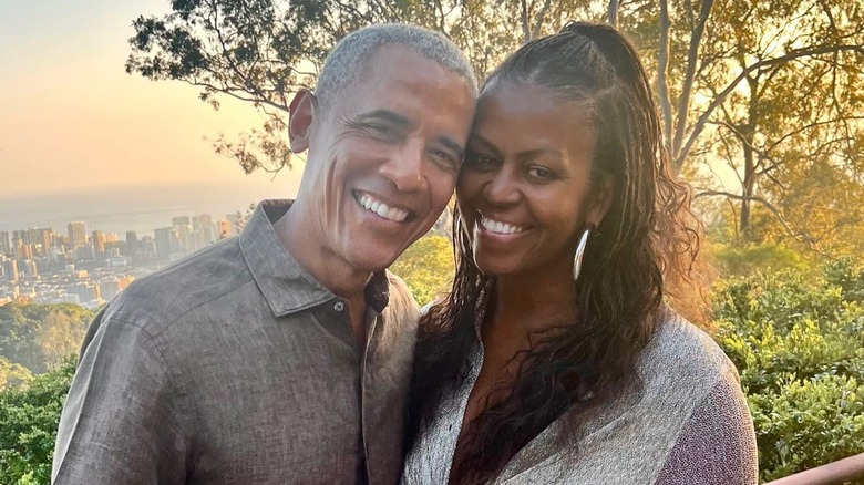 Barack Obama smiling with Michelle Obama