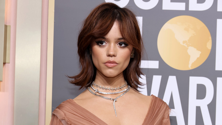 Jenna Ortega with a short auburn bob