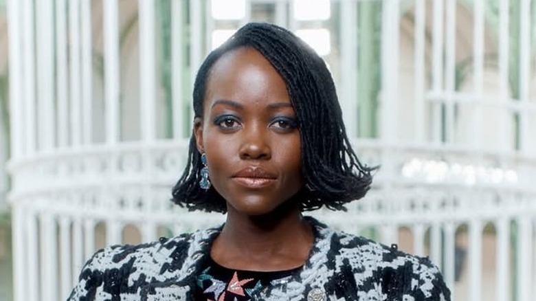 Lupita Nyong'o rocking a flippy bob with a side part