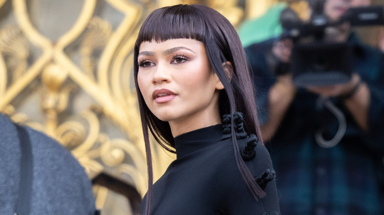 Zendaya posing with a sci-fi mini bangs ahead of "Dune: Part Two"