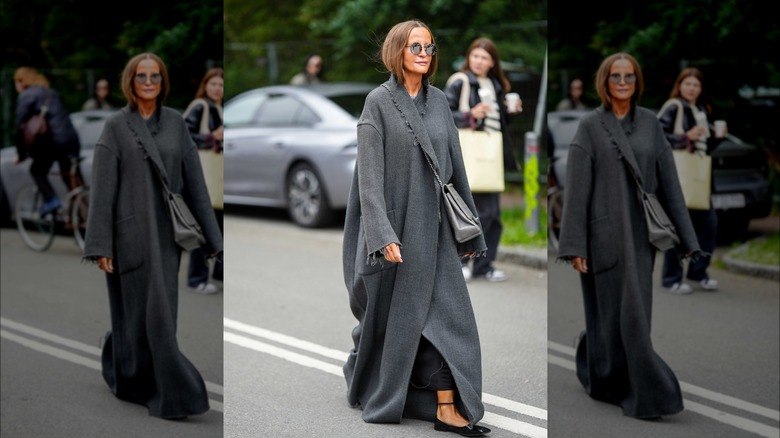 Woman wearing floor length coat