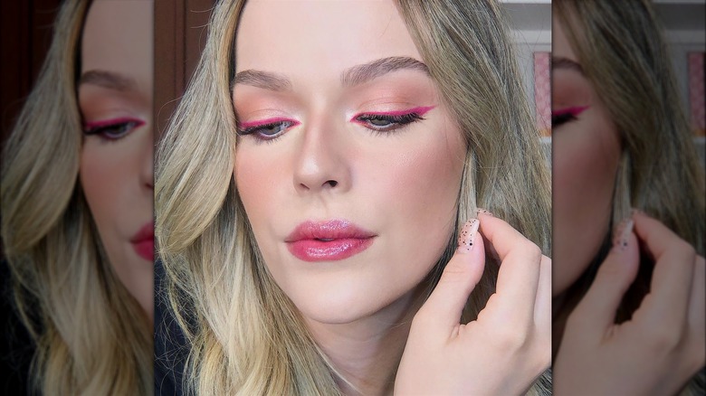 Woman wearing pink eyeliner