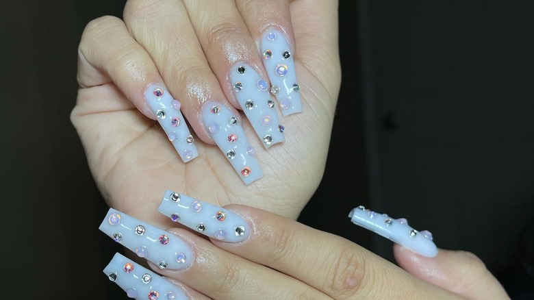 Milky white nails with silver and white gems