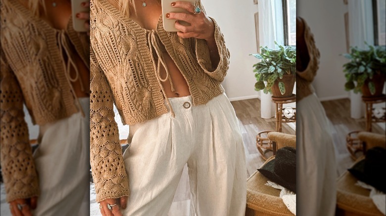 Woman wearing beige crochet cardigan 