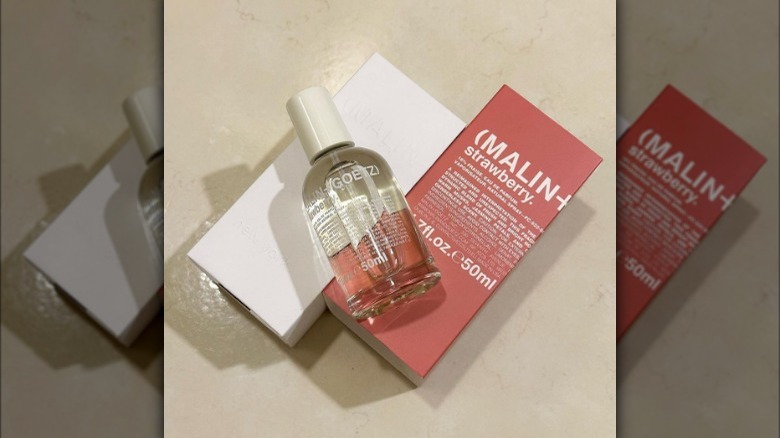 Malin + Goetz strawberry fragrance flatlay