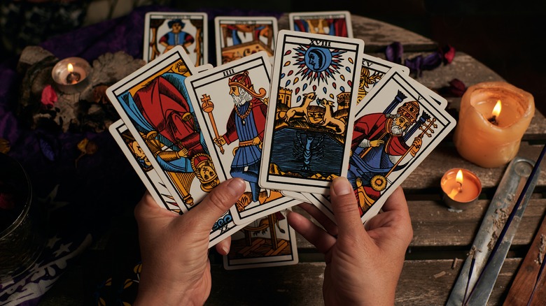 Tarot cards in hands