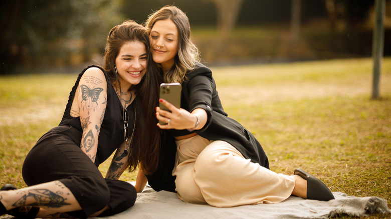 Women on date taking selfie