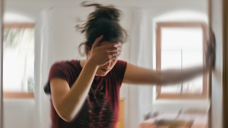 Woman experiencing dizziness