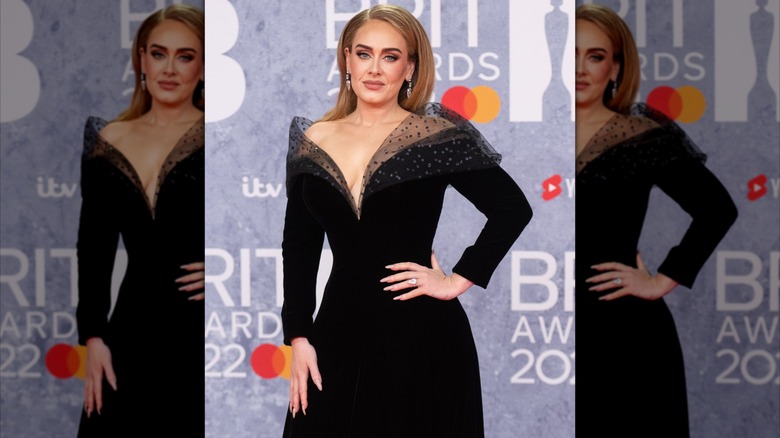 Adele in a black dress with sheer tulle at the 2022 Brit Awards