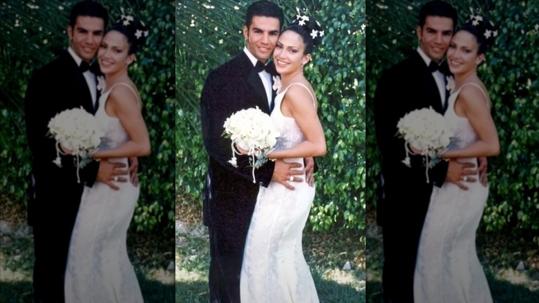 A wedding photo of Ojani Noa hugging Jennifer Lopez