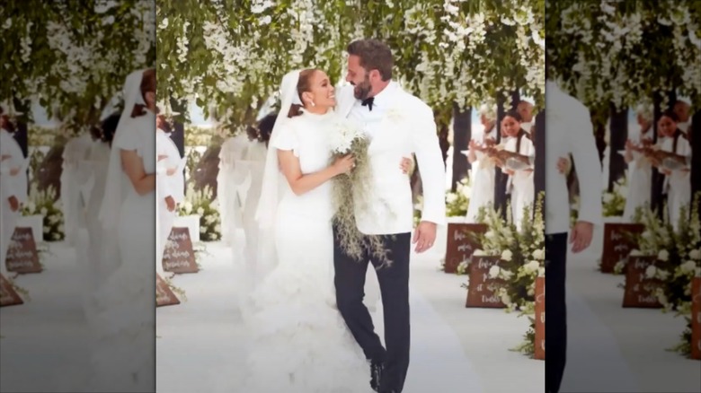 Jennifer Lopez and Ben Affleck walking up the wedding aisle