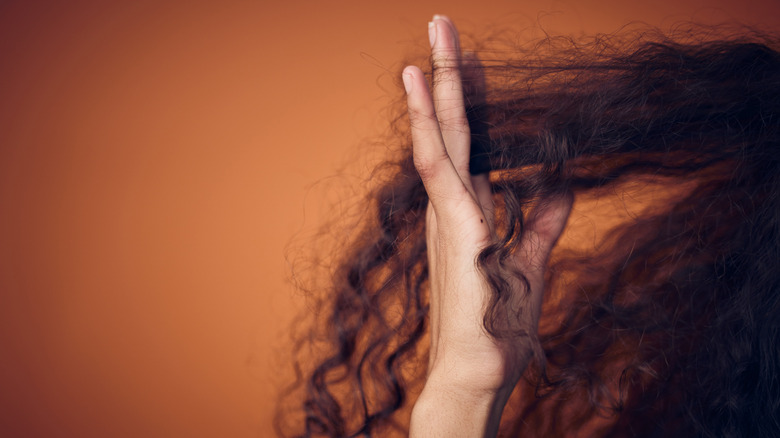 woman finger-combing hair
