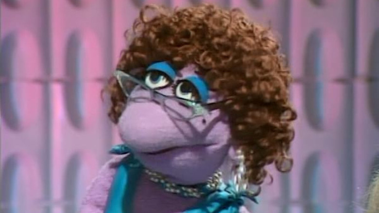 purple muppet with curls