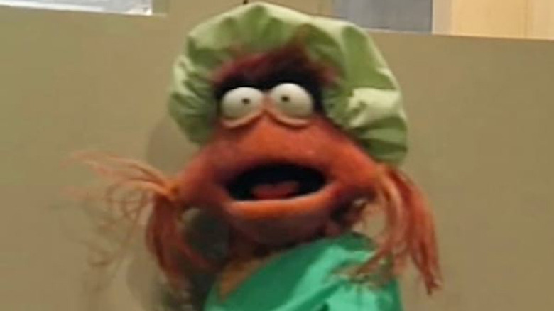 muppet with green bonnet