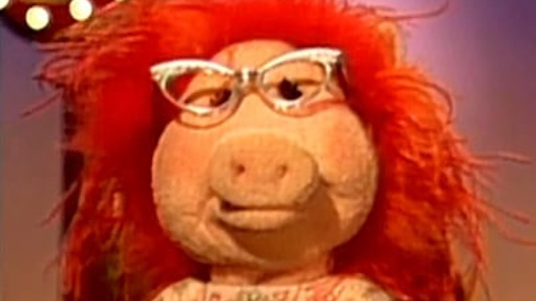 red-headed muppet with glasses