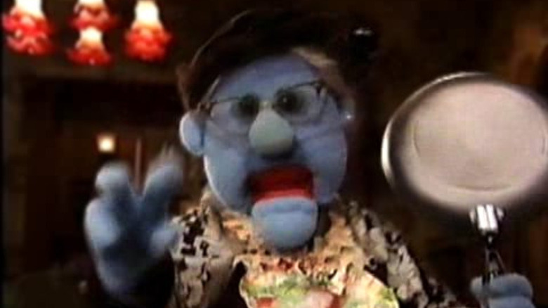 blue muppet with glasses