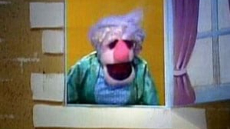 lady muppet in window