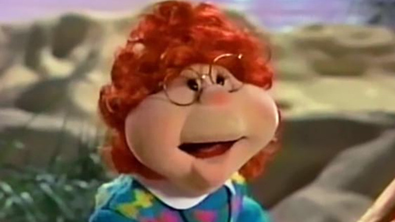 muppet with red hair and glasses