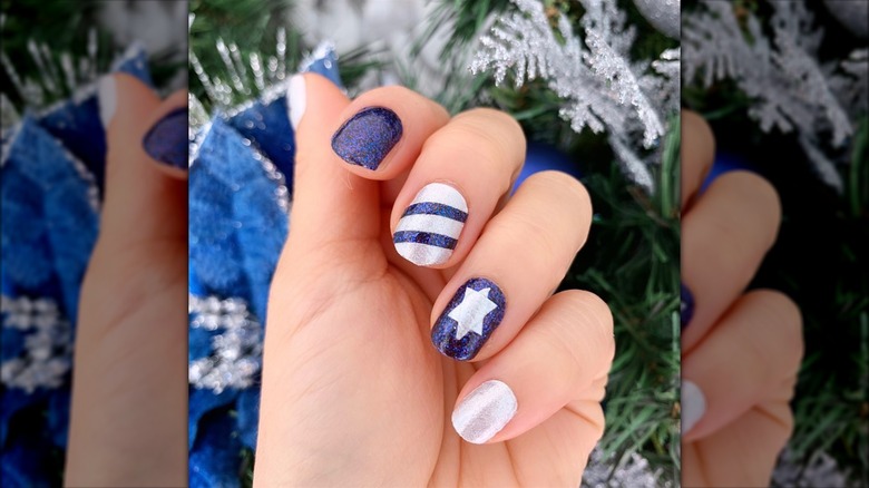 Blue and white Hanukkah nails