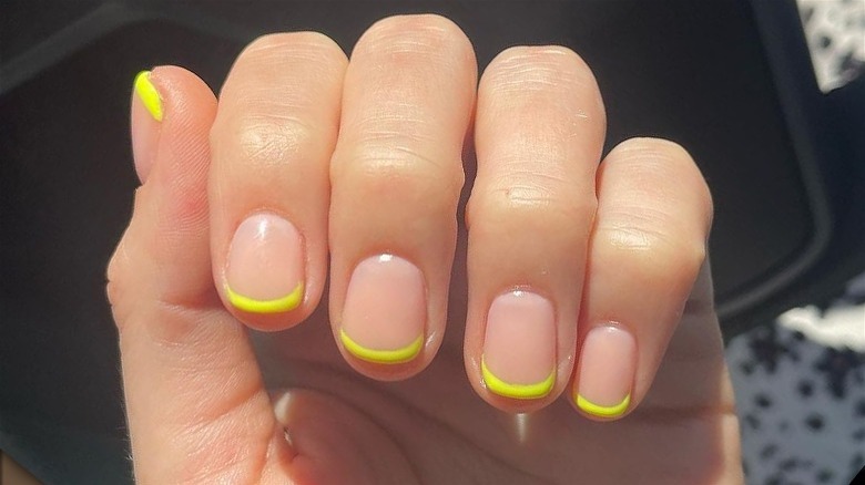 A French manicure with yellow tips