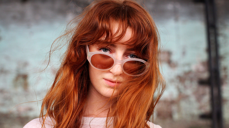 Woman with long hair and sunglasses 