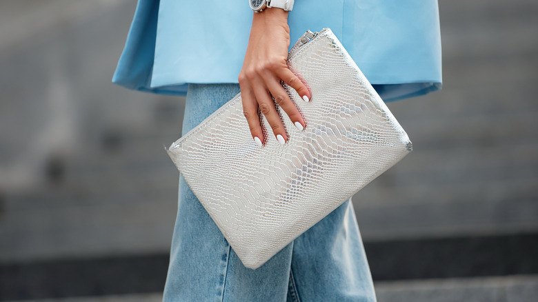 Woman holding a clutch bag