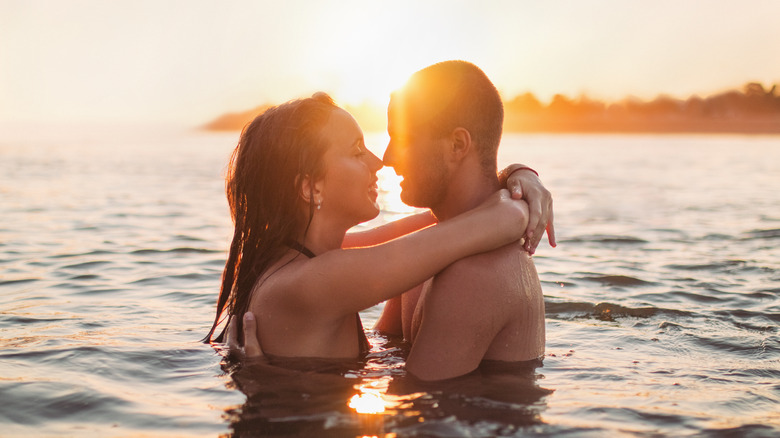 Couple making out in water