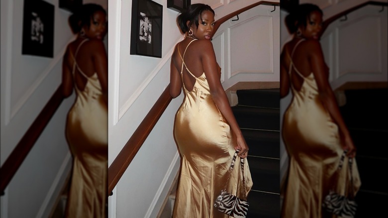 A woman on Instagram in a gold dress 